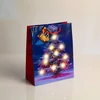 Kép 3/5 - Ajándéktasak - 10 melegfehér LED, papír - 265 x 127 x 330 mm - 4 féle / csomag - 12 db / csomag