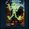 Kép 1/3 - Halloween-i foszforeszkáló ablakdekor - csontváz - 24 x 15 cm